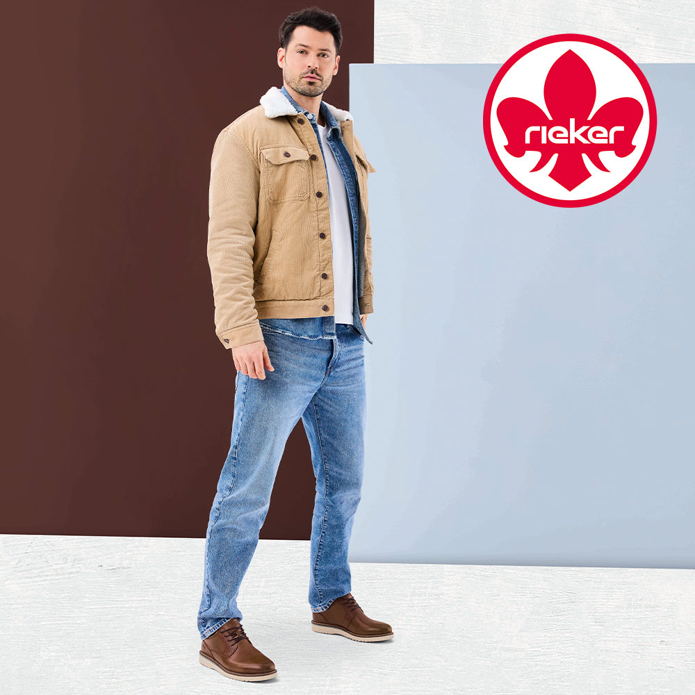 Image of a man standing against a brown and blue background wearing brown Rieker boots