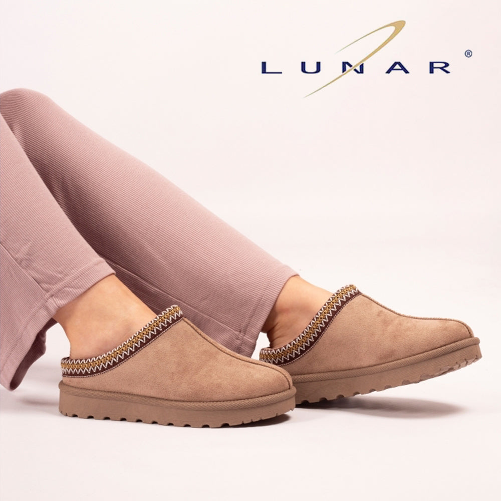 Image of a woman's feet wearing Lunar slippers