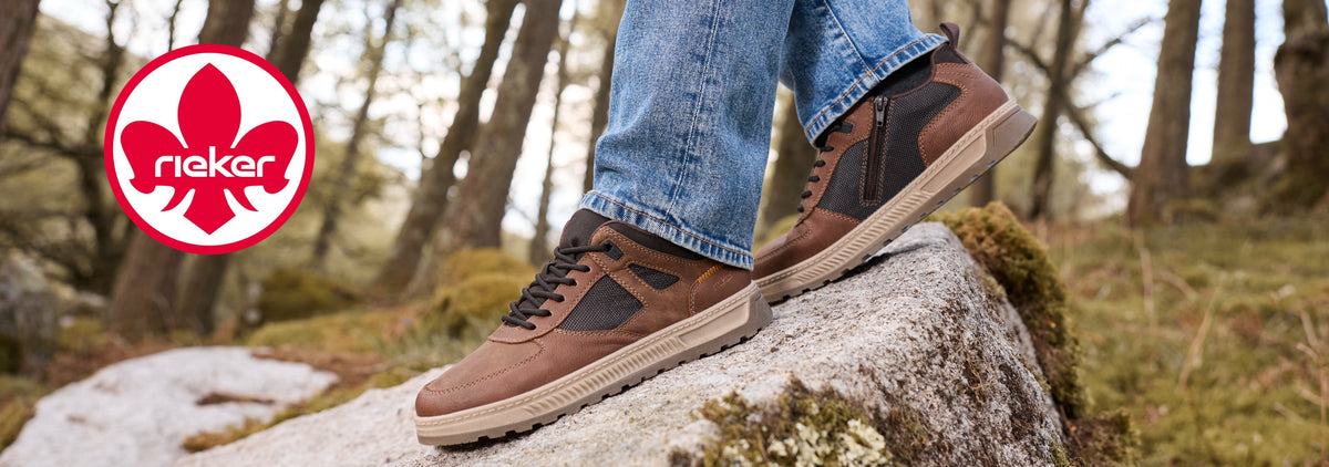brown rieker trainers standing on a rock