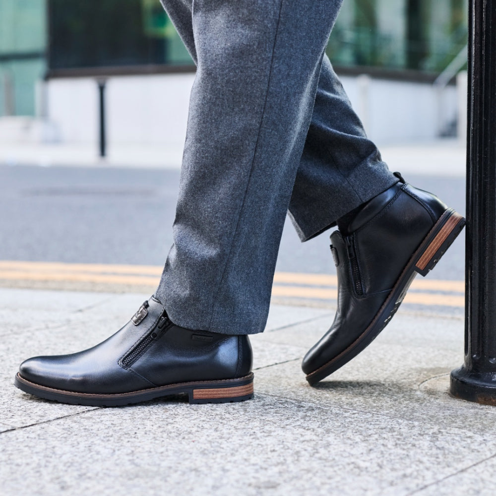 A close up of a pair of smart black shoes