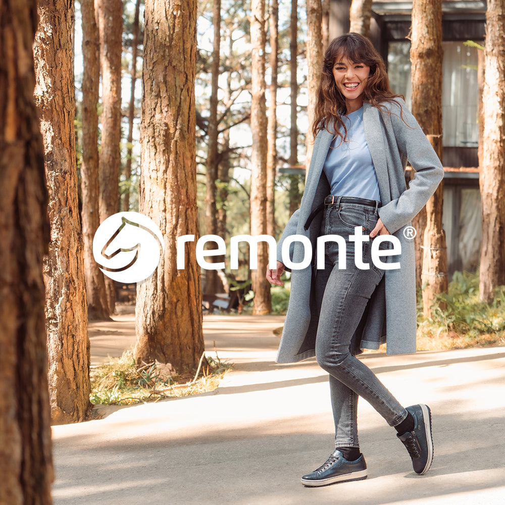 Image of a woman walking in a forest wearing Remonte shoes