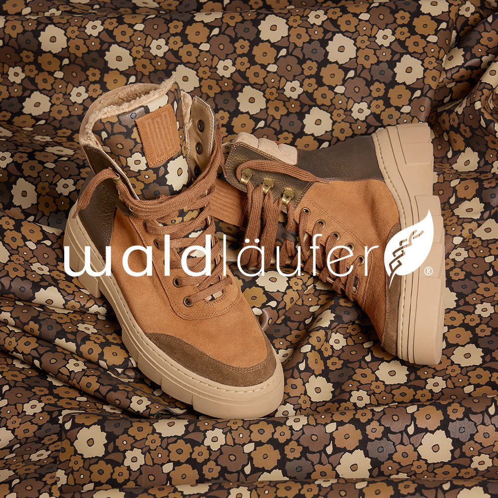 Image of Waldlaufer boots on a floral patterned background