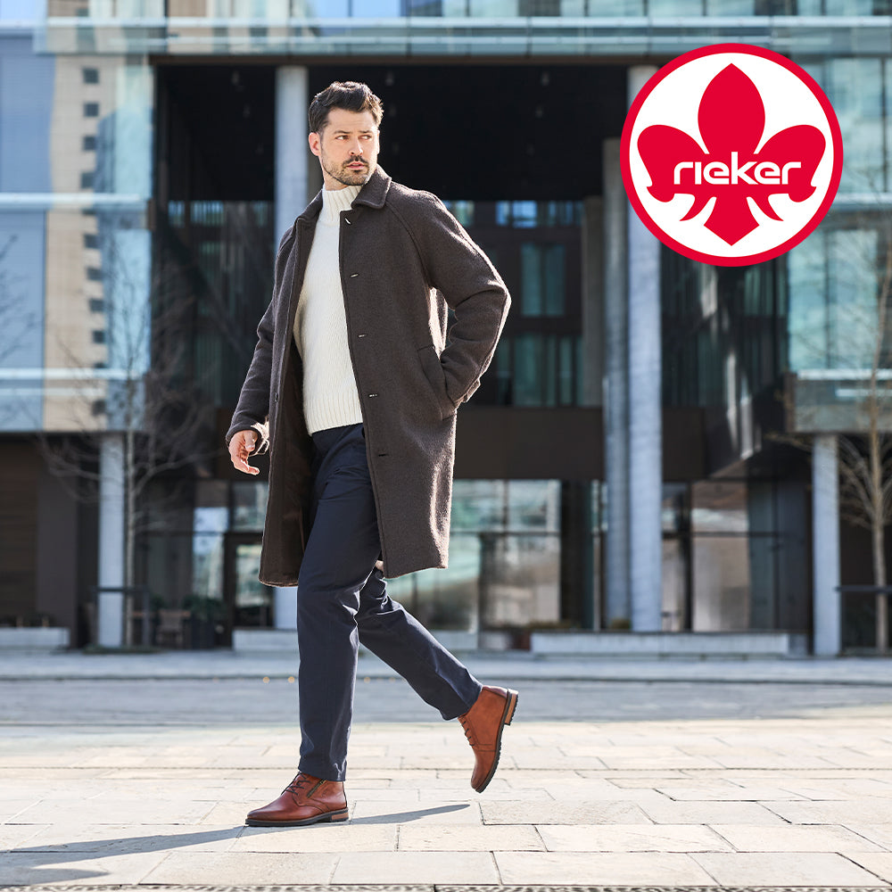 Image of a man wearing brown Rieker shoes